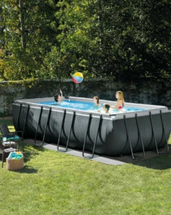 Rectangular Ultra XTR® Frame Above Ground Pool W/ Sand Filter Pump - 18' X 9' X 52" -INTEXCORP Shop 26355EH A03 inuse lifestyle 2000x2500 9ccac2e 51602.1687368300
